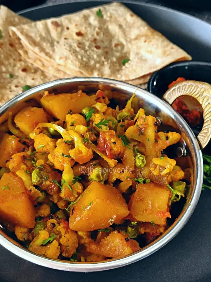 Aloo Gobi Matar Sabji | Cauliflower, Potatoes & Peas Curry https://thespicycafe.com/wp-content/uploads/2024/01/1-aloo-gobi-matar-sabji-cauliflower-potatoes-and-peas-curry-easy-quick-simple-lunch-dinner-sunday-meals-vegan-vegetarian-healthy-tiffin-box-lunch-box-Indian-restaurant-style-recipe.png https://thespicycafe.com/aloo-gobi-matar-sabji-recipe/