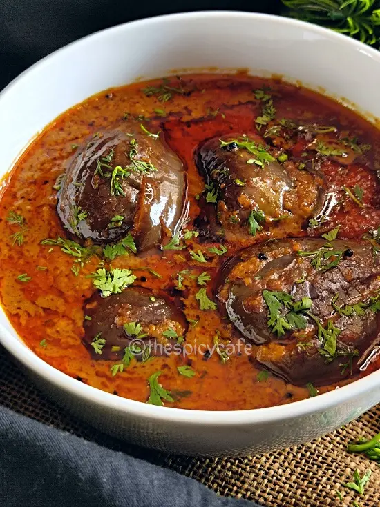 Bharli Vangi Maharashtrian Style | Stuffed Eggplant Curry Indian Recipe https://thespicycafe.com/wp-content/uploads/2023/08/1-bharli-vangi-bharwa-baingan-stuffed-eggplants-aubergine-peanut-curry-vegan-vegetarian-easy-quick-simple-brinjal-curry-lunch-dinner-gravy-indian-maharashtrian-vangi.png https://thespicycafe.com/bharli-vangi/