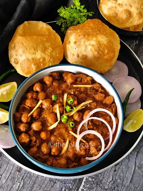 Chole Masala | Punjabi Chole Masala Recipe| Chickpea Curry https://thespicycafe.com/wp-content/uploads/2023/10/1-chole-masala-chole-bhature-chickpea-curry-vegan-vegetarian-garbanzo-beans-protein-rich-easy-quick-simple-restaurant-style-punjabi-chole-chana-masala-lunch-dinner-breakfast-Indian-dish-thespicycafe.png https://thespicycafe.com/punjabi-chole-masala/