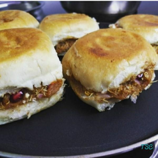 How to make Dabeli -Popular Indian Street Food https://thespicycafe.com/wp-content/uploads/2020/12/indian-street-food-snack-kutchi-dabeli-recipe-potato-aloo-filling-in-bread-vegetarian-recipe.jpg https://thespicycafe.com/tag/gujrati-food/
