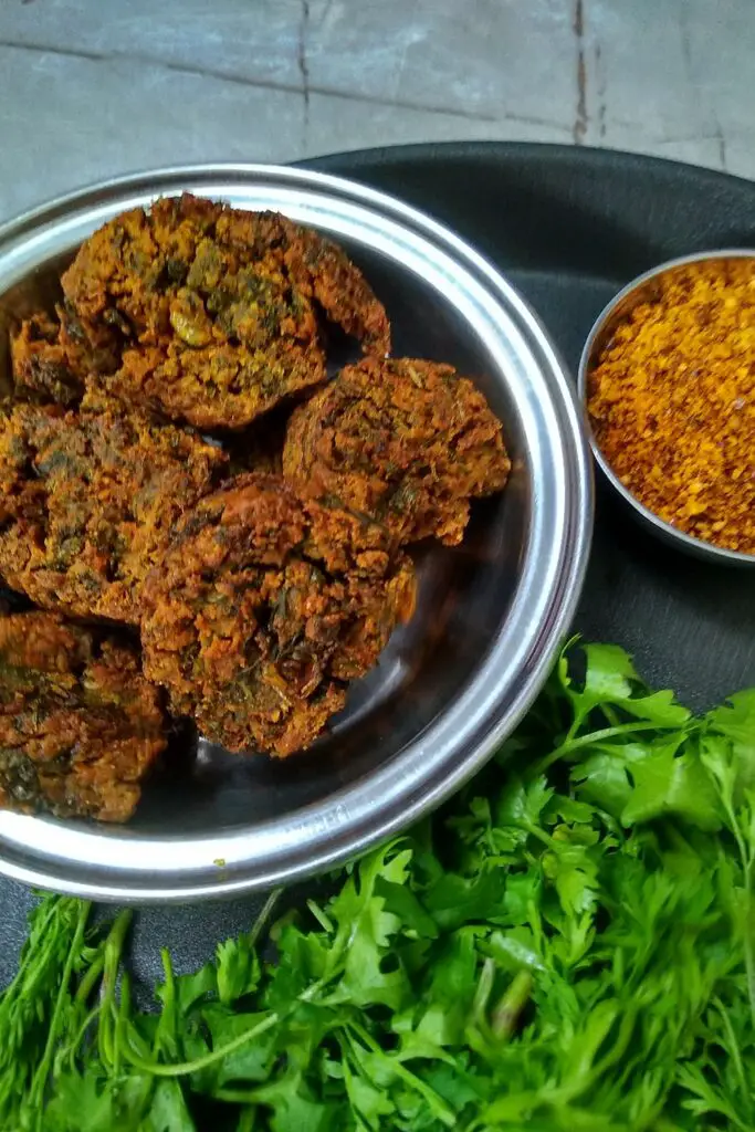 Kothimbir Vadi | How to make Popular Maharashtrian Kothimbir Vadi https://thespicycafe.com/wp-content/uploads/2020/12/kothimbir-vadi-vegan-and-healthy-maharashtrian-recipe-1.jpg https://thespicycafe.com/how-to-make-kothimbir-vadi/