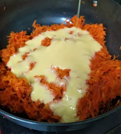 Carrot Pudding With Condensed Milk - Gajar Ka Halwa https://thespicycafe.com/wp-content/uploads/2021/12/gajar-halwa-gajar-ka-halwa-poori-carrot-pudding-vegetarian-indian-sweet-dessert-recipe.jpg https://thespicycafe.com/carrot-pudding-gajar-ka-halwa-recipe/