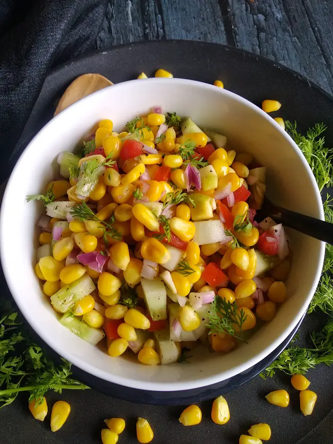 Corn And Raw Mango Salad - Indian Style (Summer Salad) https://thespicycafe.com/wp-content/uploads/2022/04/1-vegan-corn-raw-mango-salad-indian-style-glutenfree.jpg https://thespicycafe.com/corn-and-raw-mango-salad-recipe/