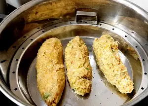 Dudhi Muthiya | Lauki Muthiya Recipe | Steamed Bottle Gourd Dumplings https://thespicycafe.com/wp-content/uploads/2022/07/dudhi-muthiya-lauki-muthiya-popular-gujarati-indian-snack-recipe.jpg https://thespicycafe.com/dudhi-muthiya/