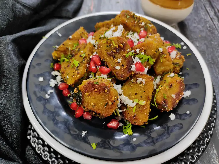 Dudhi Muthiya | Lauki Muthiya Recipe | Steamed Bottle Gourd Dumplings https://thespicycafe.com/dudhi-muthiya/