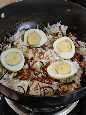 Egg Biryani | Anda Biryani (Simple Homestyle Recipe) A delicious one-pot, protein-rich rice preparation made with long-grain basmati rice cooked in aromatic spices & eggs. https://thespicycafe.com/wp-content/uploads/2022/10/homestyle-egg-biryani-anda-biryani-easy-delicious-weekend-lunch-dinner-recipes-non-veg-food-recipes-Indian.jpg https://thespicycafe.com/egg-biryani/