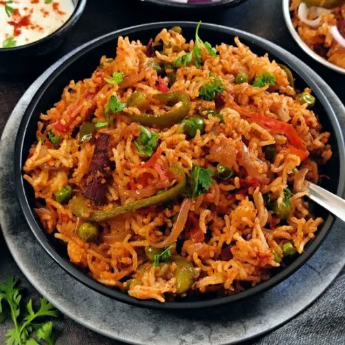 Tawa Pulao Recipe (Mumbai Street Style) https://thespicycafe.com/wp-content/uploads/2023/01/1-tawa-pulao-street-style-mumbai-street-food-style-pav-bhaji-pulao-pulav-rice-vegan-vegetarian-gluten-free-indian-recipe.jpg https://thespicycafe.com/tawa-pulao-street-style-recipe/