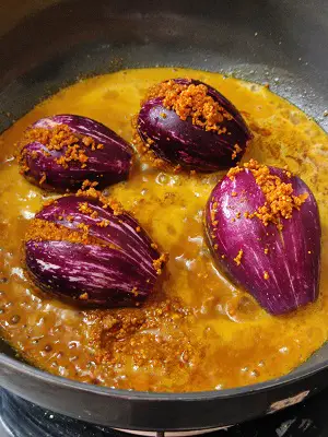 Bharli Vangi Maharashtrian Style | Stuffed Eggplant Curry Indian Recipe https://thespicycafe.com/wp-content/uploads/2023/08/1-bharli-vangi-bharwa-baingan-stuffed-eggplants-aubergine-peanut-curry-vegan-vegetarian-easy-quick-simple-brinjal-curry-lunch-dinner-gravy-indian-maharashtrian-vangi.png https://thespicycafe.com/bharli-vangi/
