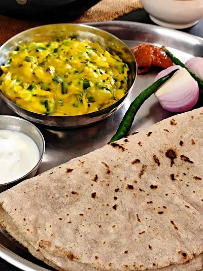 Sanja - Tikhat Sheera (Maharashtrian Breakfast Recipe) https://thespicycafe.com/wp-content/uploads/2023/02/sanja-maharashtrian-breakfast-upma-snack-recipe-Indian-vegan-vegetarian-fiber-rich-healthy-breakfast-street-food-mumbai-marathi.jpg https://thespicycafe.com/maharashtrian-sanja-tikhat-sheera/