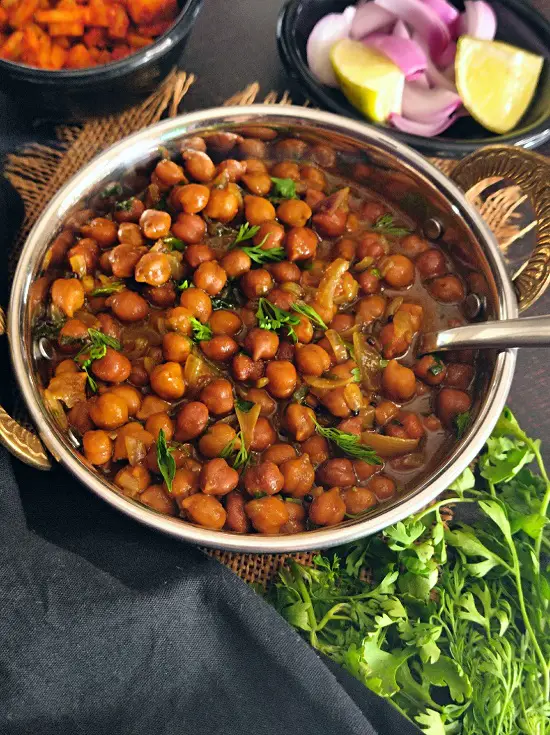 Kala Chana Masala Recipe (Black Chickpea Curry) https://thespicycafe.com/wp-content/uploads/2023/01/kala-chana-masala-recipe-desi-black-chickpea-vegan-vegetarian-Indian-curry-recipe-easy-lunch-dinner-recipe.jpg https://thespicycafe.com/tag/chana-masala-dhabastyle/
