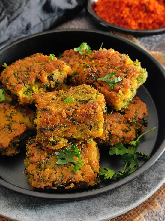 Easy Maharashtrian Kothimbir Vadi Without Steaming https://thespicycafe.com/wp-content/uploads/2023/01/kothimbir-vadi-maharashtrian-traditional-vegan-vegetarian-Indian-recipe.jpg https://thespicycafe.com/tag/maharashtrian-recipe/