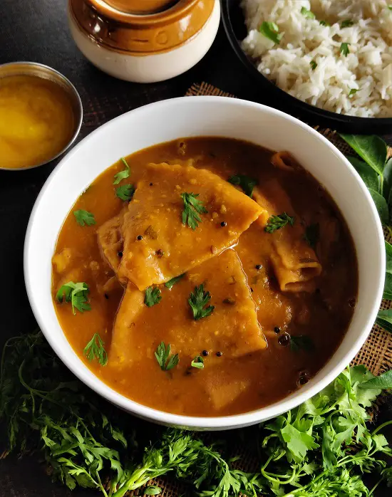 Varanfal / Chakolya - Dal Dhokli Recipe https://thespicycafe.com/wp-content/uploads/2023/01/traditional-gujarati-dal-dhokli-recipe-authentic-maharashtrian-varanfal-recipe-vegan-vegetarian.jpg https://thespicycafe.com/category/no-onion-garlic-recipes/