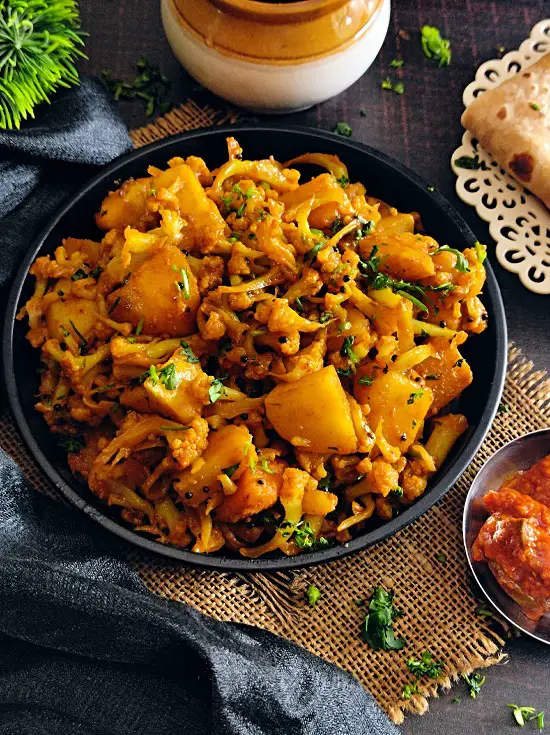 Flower Batata Sukhi Bhaji | Aloo Gobi Maharashtrian Recipe https://thespicycafe.com/wp-content/uploads/2023/02/2-maharashtrian-flower-batata-sukhi-bhaji-rassa-aloo-gobi-cauliflower-potato-curry-Indian-easy-simple-vegan-vegetarian-lunch-dinner-recipe.jpg https://thespicycafe.com/tag/easy-indian-recipes/