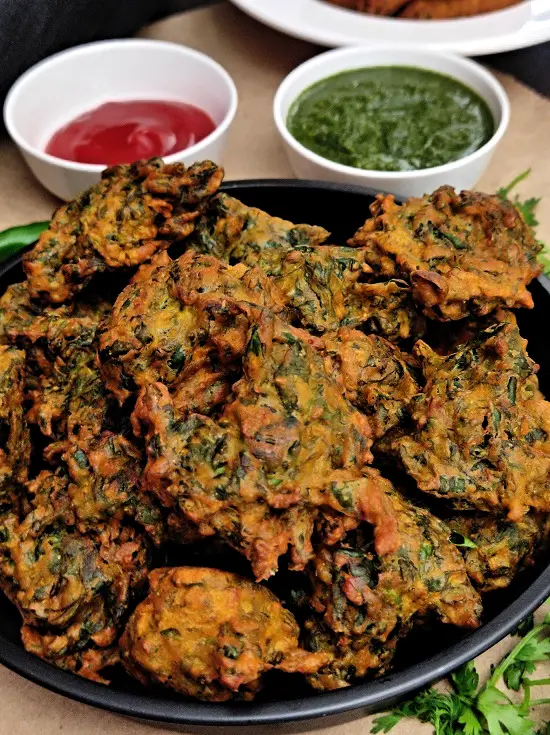 Methi pakoda, a delicious vegan vegetarian fenugreek fritter recipe. This is a gluten-free Indian street style snack recipe which turns out crispy from outside and soft from inside.