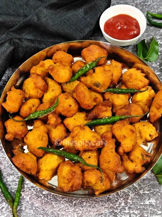 Moong Dal Pakoda | Moong Dal Vada | Moong Dal Bhajiya Recipe https://thespicycafe.com/wp-content/uploads/2023/07/11-1-moong-dal-pakoda-monsoon-snack-moong-bhajiya-moong-bhajji-bhajee-yellow-mung-bean-fritters-vegan-vegetarian-protein-rich-easy-quick-simple-breakfast-lunch-dinner.png https://thespicycafe.com/tag/vegan-indian-recipes/