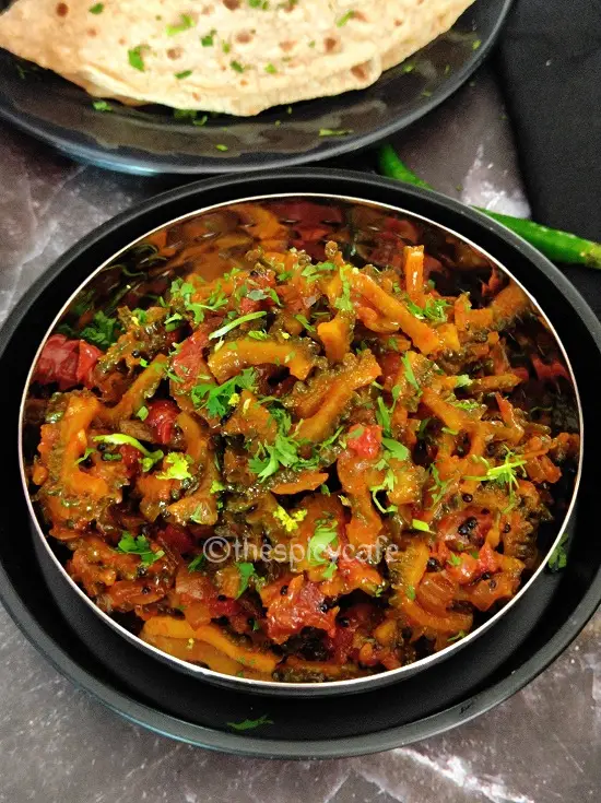Karlyachi Bhaji | Karela Sabzi |Bitter Gourd Stir Fry https://thespicycafe.com/wp-content/uploads/2023/08/1-karla-sabji-karlyachi-bhaji-maharashtrian-karela-sabji-easy-quick-vegan-vegetarian-bitter-gourd-stir-fry-lunch-dinner.png https://thespicycafe.com/tag/indianrecipes/