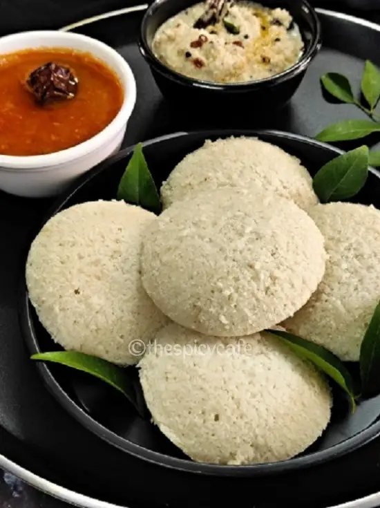 Idli Recipe | How To Make Idli https://thespicycafe.com/wp-content/uploads/2023/08/1-idli-chutney-south-indian-breakafst-recipe-easy-quick-simple-healthy-vegan-vegetarian-popular-street-food-lunch-dinner-sambar-rassam.png https://thespicycafe.com/how-to-make-idli-recipe/