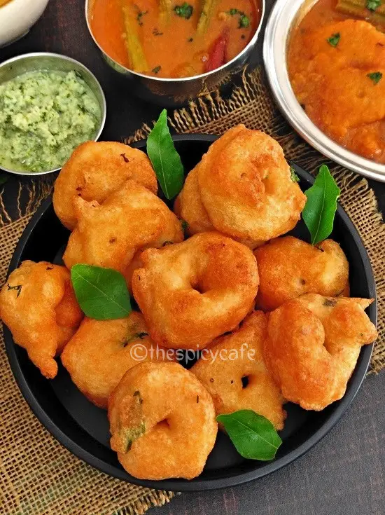 Medu Vada Recipe | Urad Dal Vada https://thespicycafe.com/wp-content/uploads/2023/04/1-medu-vada-south-indian-ulundu-uddina-geralu-uzhunnu-urad-dal-vada-breakfast-snack-vegan-vegetarian-easy-quick-simple-Indian-snack-recipe.jpg https://thespicycafe.com/medu-vada-recipe/