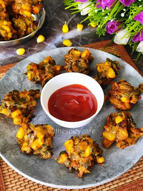 Corn Palak Pakoda | Spinach Corn Fritters | कुरकुरे पालक और कॉर्न के पकोड़े https://thespicycafe.com/wp-content/uploads/2023/09/1-corn-palak-pakoda-spinach-fritters-vegan-vegetarian-delicious-easy-quick-simple-Indian-deep-fried-snack-recipe-lunch-dinner-party-appetizer.png https://thespicycafe.com/corn-palak-pakoda/