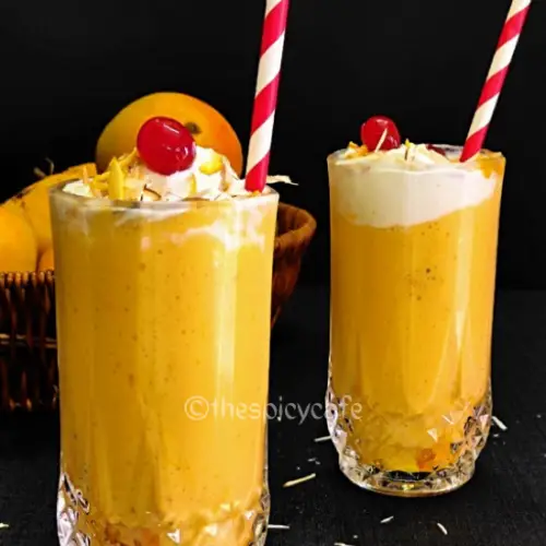 Mango Mastani Recipe https://thespicycafe.com/wp-content/uploads/2023/10/mango-mastani-indian-mango-milkshake-vegetarian-vanilla-ice-cream-smoothie-summer-drink-beverage-delicious-easy-quick-simple-snack-breakfast-kids-recipe-thespicycafe.png https://thespicycafe.com/mango-mastani-recipe/