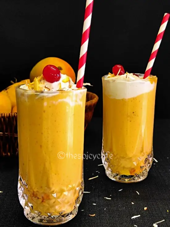 Mango Mastani Recipe https://thespicycafe.com/wp-content/uploads/2023/10/mango-mastani-indian-mango-milkshake-vegetarian-vanilla-ice-cream-smoothie-summer-drink-beverage-delicious-easy-quick-simple-snack-breakfast-kids-recipe-thespicycafe.png https://thespicycafe.com/tag/alphanso-mango/