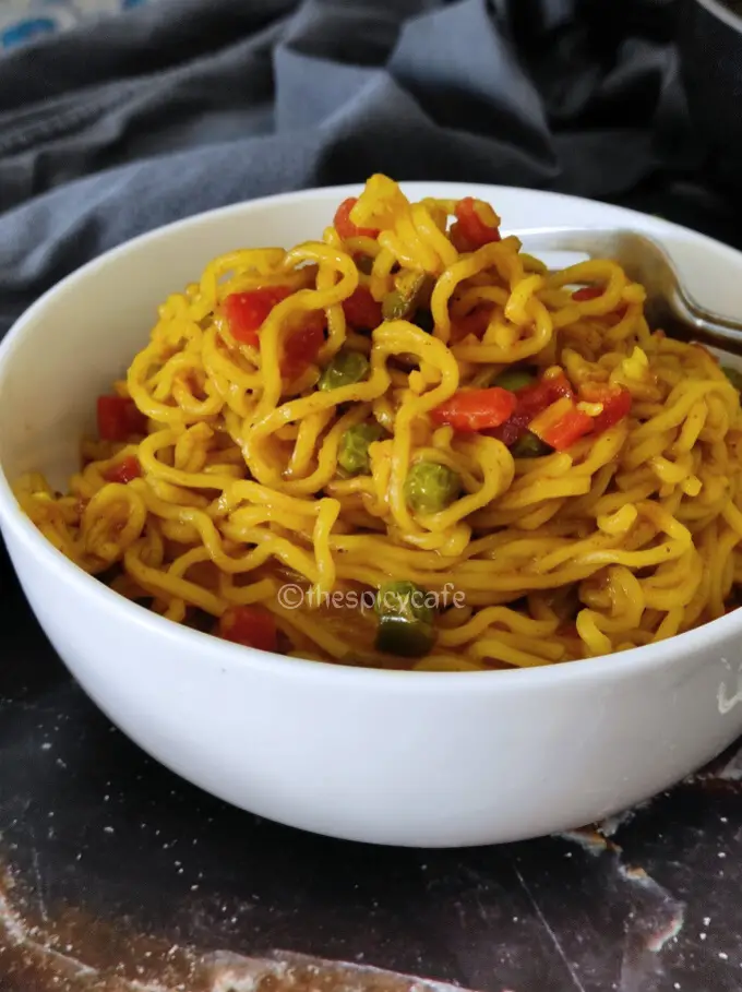 Maggi Noodles Recipe | Vegetable Maggi Masala Noodles Recipe https://thespicycafe.com/wp-content/uploads/2024/01/1-instant-maggi-masala-noodles-Indian-snack-easy-quick-simple-lunch-dinner-brunch-kids-vegan-vegetarian-party-appetizer.png https://thespicycafe.com/instant-maggi-masala-noodles-recipe/